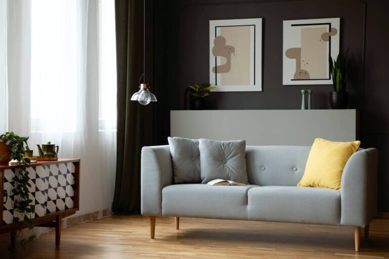 grey-lounge-with-yellow-cushion-in-real-photo-of-dark-living-roo.jpg